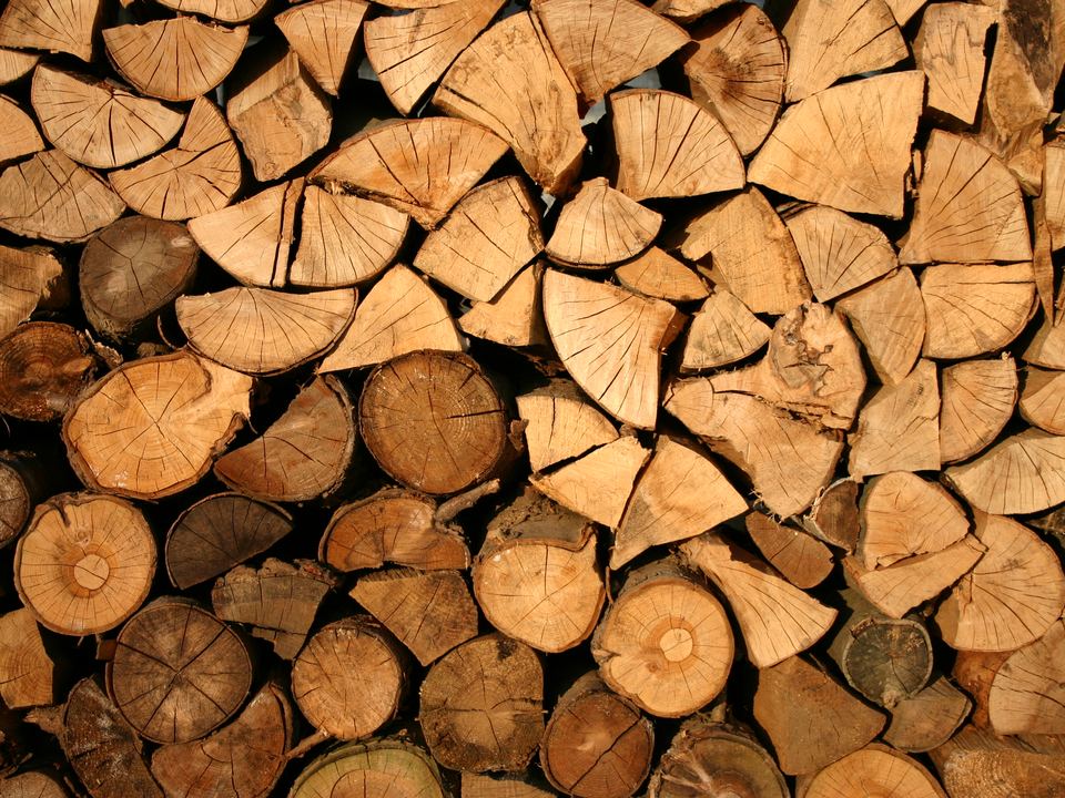 Split hardwood firewood stacked in a pile